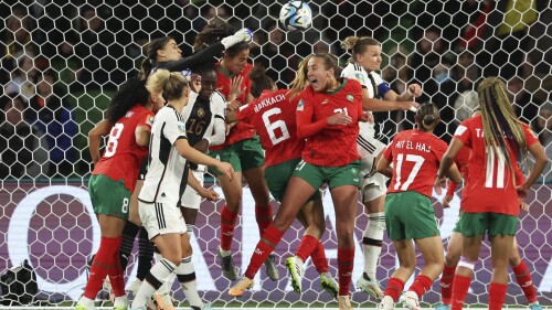 Morocco's goalkeeper Khadija Er-Rmichi tries to punch the ball away as players collide in front of the Moroccan net, leading to an own goal, during the Women's World Cup Group H soccer match between Germany and Morocco in Melbourne, Australia, Monday, July 24, 2023. (AP Photo/Victoria Adkins)