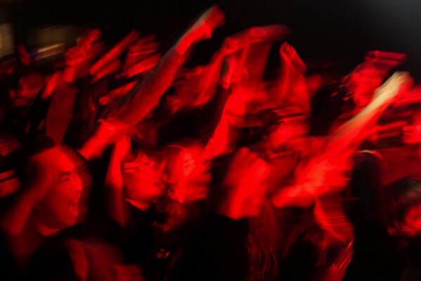 The crowd dances as they attend a punk festival in Hangzhou, China, Friday, Jan. 17, 2025. (AP Photo/Aaron Favila)