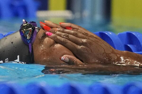 Simone Manuel reacts after the women's 50 freestyle during wave 2 of the U.S. Olympic Swim Trials on Sunday, June 20, 2021, in Omaha, Neb. (AP Photo/Charlie Neibergall)