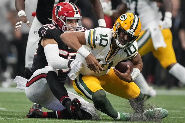 Atlanta Falcons linebacker Kaden Elliss (55) sacks Green Bay Packers quarterback Jordan Love (10) during the first half of an NFL football game, Sunday, Sept. 17, 2023, in Atlanta. (AP Photo/Brynn Anderson)