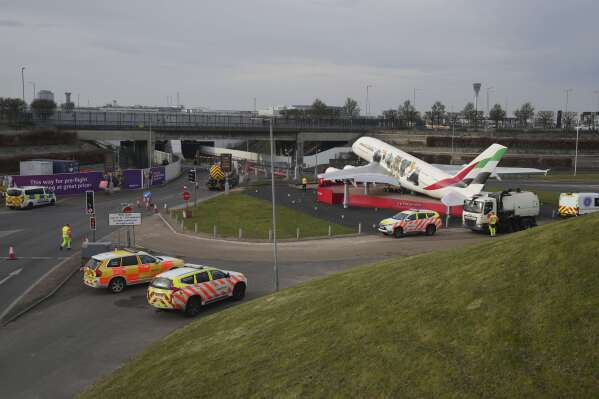 Roads leading to the airport have been blocked as Britain's Heathrow Airport has closed for the full day Friday after an electrical substation fire knocked out its power, disrupting flights for hundreds of thousands of passengers at one of Europe's biggest travel hubs in London, Friday, March 21, 2025.(AP Photo/Kin Cheung)