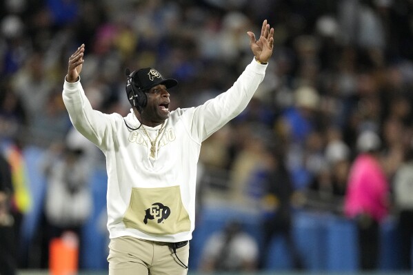 Colorado head coach Deion Sanders gestures during the second half of an NCAA college football game against UCLA Saturday, Oct. 28, 2023, in Pasadena, Calif. (AP Photo/Mark J. Terrill)