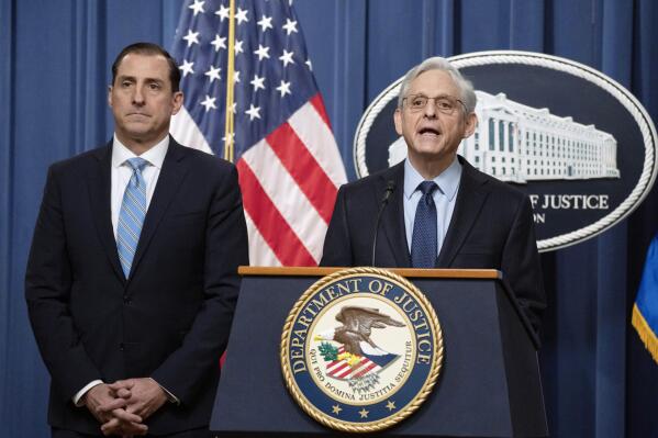 Attorney General Merrick Garland speaks during a news conference at the Department of Justice, Thursday, Jan. 12, 2023, in Washington, as John Lausch, the U.S. Attorney in Chicago, looks on. (AP Photo/Manuel Balce Ceneta)