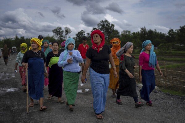 Members of Meira Paibis, powerful vigilante group of Hindu majority Meitei women, march toward the site of a gunfight in Kangchup, near Imphal, capital of the northeastern Indian state of Manipur, Thursday, Jun 22, 2023. A deadly conflict in Manipur between two communities since May have left more than 130 people dead. (AP Photo/Altaf Qadri)