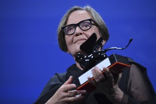 Polish director Agnieszka Holland poses with the 'Special Jury Prize' award for 'Zielona Granica' after the closing ceremony for the 80th edition of the Venice Film Festival in Venice, Italy, Saturday, Sept. 9, 2023. (Gian Mattia D'Alberto/LaPresse via AP)