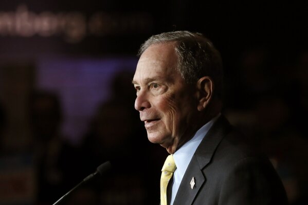 FILE - In this Tuesday, Feb. 4, 2020, file photo, Democratic presidential candidate and former New York City Mayor Michael Bloomberg talks to supporters, in Detroit. Bloomberg won the votes of New Hampshire's Dixville Notch community, hanging onto its tradition of being among the first to cast ballots in the presidential primary, early Tuesday, Feb. 11. (AP Photo/Carlos Osorio, File)