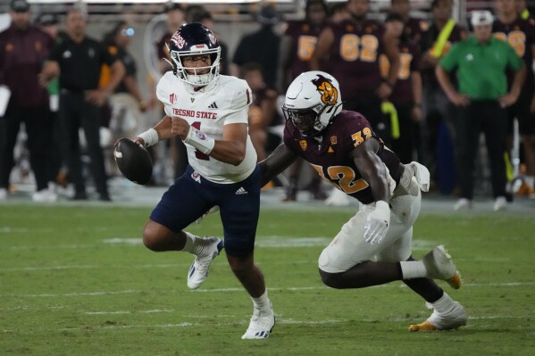 Arizona State defensive lineman Prince Dorbah (32) pressures Fresno State quarterback Mikey Keene during the second half during an NCAA college football game Saturday, Sept. 16, 2023, in Tempe, Ariz. (AP Photo/Rick Scuteri)