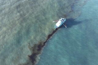 In this photo provided by the U.S. Coast Guard, a Clean Gulf Associates 95-foot response vessel skims crude oil approximately 4 miles southeast off South Pass Louisiana, Friday, Nov. 17, 2023. A Unified Command composed of the Coast Guard, Main Pass Oil Gathering Company, LLC, and the Louisiana Oil Spill Coordinator's Office is coordinating measures to assess, contain and mitigate the impact of the spill. (U.S. Coast Guard/Courtesy Clean Gulf Associates via AP)