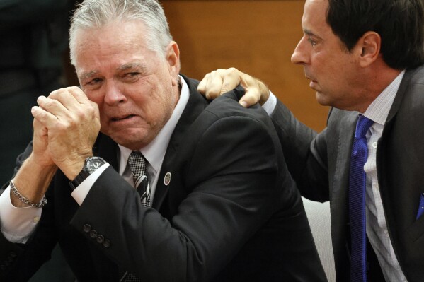 Former Marjory Stoneman Douglas High School School Resource Officer Scot Peterson reacts as he is found not guilty on all charges at the Broward County Courthouse in Fort Lauderdale, Fla., on Thursday, June 29, 2023. Peterson was acquitted of child neglect and other charges for failing to act during the Parkland school massacre, where 14 students and three staff members were murdered. (Amy Beth Bennett/South Florida Sun-Sentinel via AP, Pool)