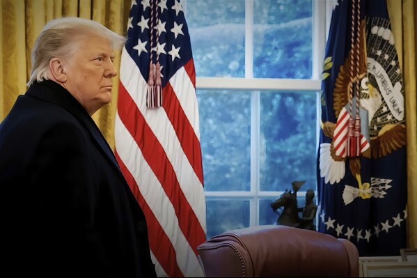 FILE - This exhibit from video released by the House Select Committee, shows a photo of President Donald Trump with his coat on as he returns to the Oval Office of the White House in Washington, after speaking on the Ellipse on Jan. 6, 2021. Former President Donald Trump repeatedly declined in an interview aired Sunday, Sept. 17, 2023, to answer questions about whether he watched the Capitol riot unfold on television, saying he would “tell people later at an appropriate time.” (House Select Committee via AP, File)