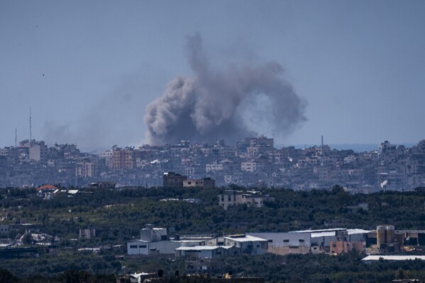 An explosion rises in the northern Gaza Strip, as seen from southern Israel, Tuesday, March 26, 2024. (AP Photo/Ariel Schalit)
