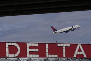FILE - A Delta airplane takes off from Hartsfield-Jackson Atlanta International Airport in Atlanta, Tuesday, Nov. 22, 2022. Delta reports earnings on Thursday, April 13, 2023. (AP Photo/Brynn Anderson, File)