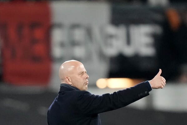 FILE- Feyenoord's head coach Arne Slot reacts to his players during the Europa League play off, first leg soccer match between Feyenoord and Roma at De Kuip stadium in Rotterdam, Netherlands, Thursday, Feb. 15, 2024. Liverpool might have found its replacement for Jurgen Klopp. Feyenoord coach Arne Slot says his Dutch club is “negotiating” with Liverpool over his possible move to Anfield. Slot tells ESPN he is “still on hold" and “we have to wait for an agreement to be reached, but I have every confidence in that.” (AP Photo/Peter Dejong, File)