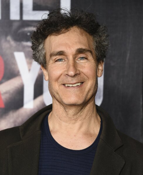FILE - Doug Liman attends the premiere of "A Quiet Place" on April 2, 2018, in New York. In four months, in the middle of a pandemic and widespread shutdowns, filmmaker Doug Liman and his team wrote, shot and edited a glossy Harrods heist film in London with Anne Hathaway and Chiwetel Ejiofor. The result, “Locked Down,” comes to HBO Max Thursday. (Photo by Evan Agostini/Invision/AP, File)