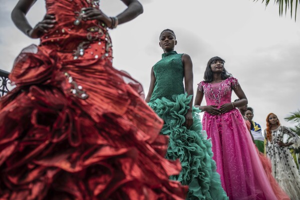 Models present dresses by Central African Republic fashion designer Ketura Kimono Milca during the ninth edition of the Liputa fashion show in Goma, Democratic Republic of Congo, Saturday, June 24, 2023. (AP Photo/Moses Sawasawa)