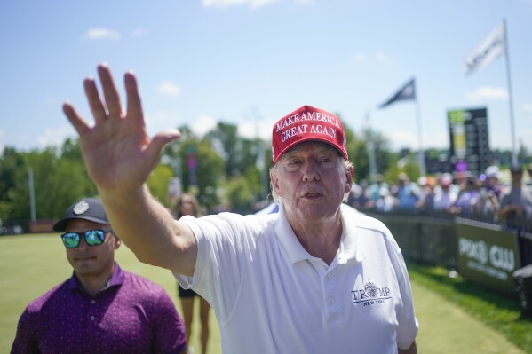 FILE - Former President Donald Trump greets supporters and sign autographs during the final round of the Bedminster Invitational LIV Golf tournament at his golf course in Bedminster, N.J., Aug. 13, 2023. On Monday, June 10, 2024, the New Jersey Attorney General’s Office said it is looking into whether the former president’s 34 felony convictions in a New York case might affect his continued ability to hold liquor licenses for this three New Jersey golf courses. (AP Photo/Seth Wenig, File)