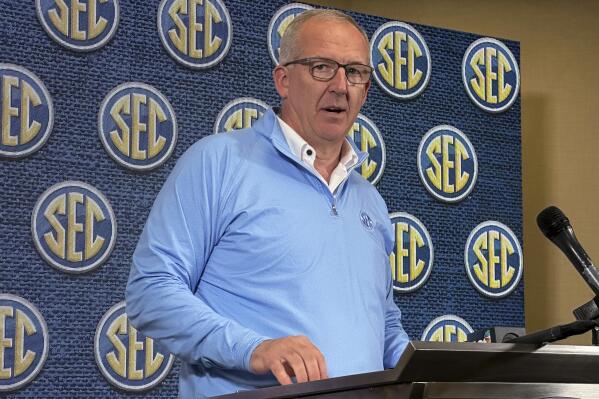 FILE - Southeastern Conference Commissioner Greg Sankey speaks to reporters during the conference's spring meetings, Tuesday, May 30, 2023, in Destin, Fla. The SEC contingent, which includes Commissioner Sankey, administrators and Alabama coach Nick Saban, will meet this week with lawmakers in Washington and ask for federal assistance in regulating how college athletes can generate NIL income.(AP Photo/Ralph Russo, File)