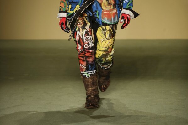 A model wears a creation by fashion designer Mokodu Fall as part of the Black Lives Matter Fall/Winter 2021/22 collective fashion show, presented in Milan, Italy, Wednesday, Feb. 17, 2021. 2021. Fi...