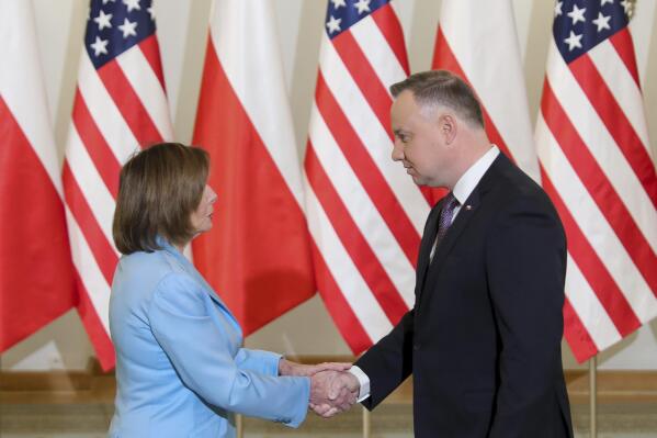In this photo released by the Office of the President of Poland U.S. Speaker of the House Nancy Pelosi, left, and Poland's President Andrzej Duda shake hands in Warsaw, Poland, Monday, May 2, 2022. (Marek Borawski/Office of the President of Poland)