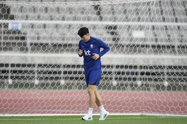 South Korea's Son Heung-min warms up during an open training session ahead of the second round of the Asian qualifier group C match for 2026 World Cup between South Korea and China, in Goyang, South Korea, Saturday, June 8, 2024. (AP Photo/Lee Jin-man)