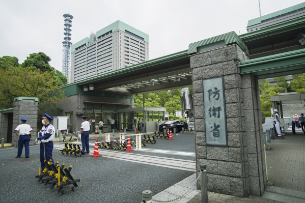 FILE - This photo shows an exterior view of the Defense Ministry of Japan with its sign at the main entrance in Tokyo on Sept. 17, 2021. A panel of experts that investigated harassment cases in Japan's military and Defense Ministry said Friday, Aug. 18, 2023, it found widespread coverups and reluctance among supervisors to deal with cases, and recommended fundamental improvements. (AP Photo/Hiro Komae, File)