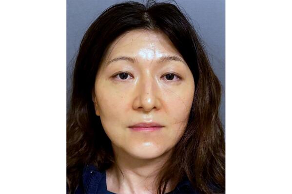 This photo provided by the Irvine Police Department shows 45-year-old Yue Yu, who was arrested late Thursday, Aug. 4, 2022, for poisoning her husband, in Irvine, Calif. Police in the Orange County city of Irvine, Calif., say a man reported he believed he was being poisoned by his wife of 10 years after he grew ill over the course of a month. (Irvine Police Department via AP)