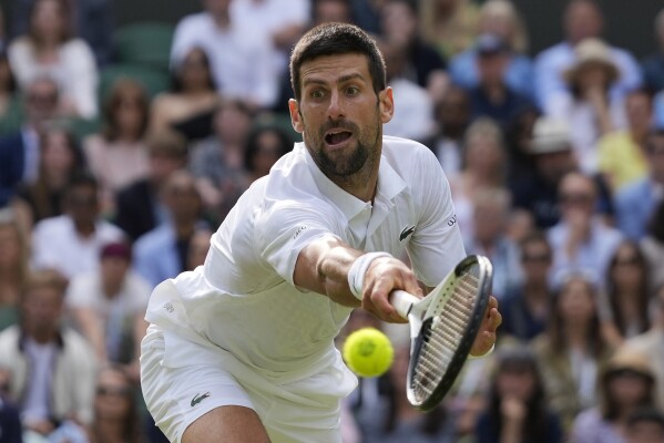 Serbia's Novak Djokovic returns to Spain's Carlos Alcaraz in the final of the men's singles on day fourteen of the Wimbledon tennis championships in London, Sunday, July 16, 2023. (AP Photo/Kirsty Wigglesworth)