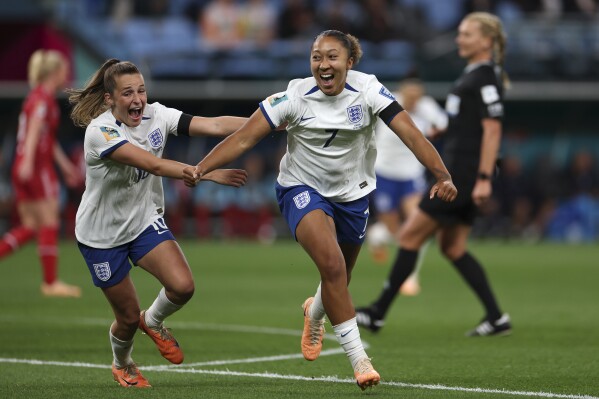 England's Lauren James, right, celebrates a first half goal with teammate England's Ella Toone during the Women's World Cup Group D soccer match between England and Denmark at Sydney Football Stadium in Sydney, Australia, Friday, July 28, 2023. (AP Photo/Sophie Ralph)