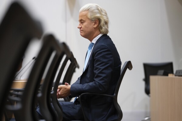 Firebrand anti-Islam lawmaker Geert Wilders listens as the court delivered it's verdict against a former Pakistan cricketer accused of incitement to kill, at the high security court building near Schiphol airport, Monday, Sept. 11, 2023. The suspect, identified by Wilders as Khalid Latif, is accused of offering a bounty of some 21,000 euros ($23,000) to anybody who killed Wilders. Prosecutors haven't named Latif. However, in a statement they say a video posted online in 2018 shows a famous Pakistan cricketer offering a bounty for killing Wilders. (AP Photo/Peter Dejong)
