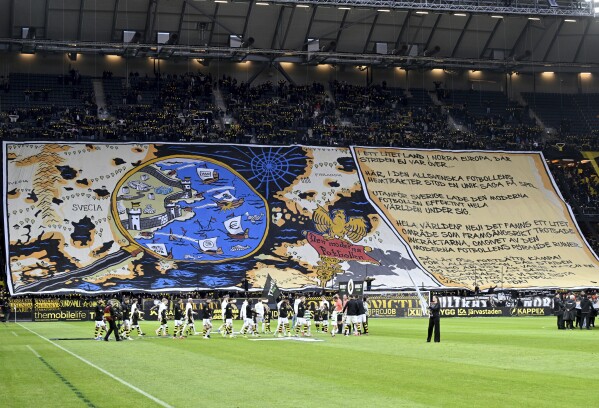 FILE - AIK's supporters hold a banner against VAR during the Allsvenskan soccer match between AIK and Västerås SF FK at the Friends Arena in Stockholm, April 1, 2024. Swedish soccer has adopted an isolationist stance in eschewing technology to retain a pure version of the beautiful game. Sweden is the only one of Europe’s top-30 ranked leagues yet to have rolled out VAR in its domestic competitions. (Jonas Ekströmer/TT News Agency via AP, File)