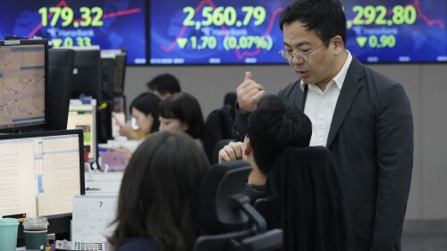 Currency traders work at the foreign exchange dealing room of the KEB Hana Bank headquarters in Seoul, South Korea, Wednesday, July 12, 2023. Asian shares were mostly higher on Wednesday after stocks advanced on Wall Street as investors awaited an update on U.S. inflation that will hopefully show a smaller increase in pain for everyone. (AP Photo/Ahn Young-joon)