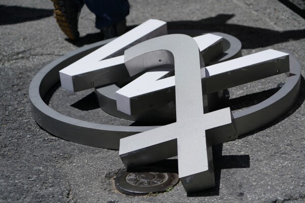 File - Characters removed from a sign on the Twitter headquarters building are piled on a street in San Francisco on July 24, 2023. A little more than a year ago, Elon Musk walked into Twitter's San Francisco headquarters, fired its CEO and other top executives and began transforming the social media platform into what's now known as X. (AP Photo/Godofredo A. Vásquez, File)