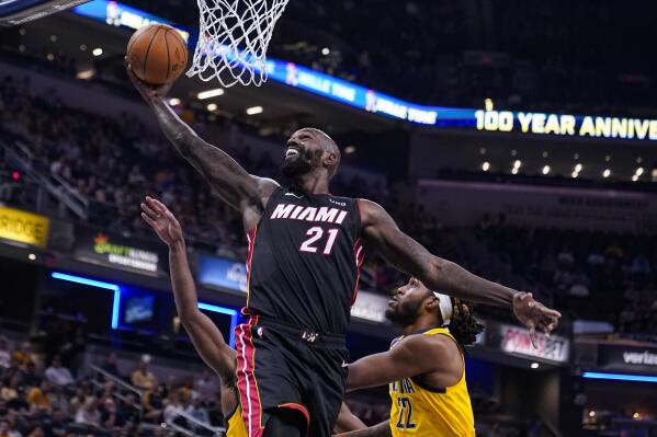 FILE - Miami Heat center Dewayne Dedmon (21) shoots in front of Indiana Pacers guard Buddy Hield (24) and forward Isaiah Jackson (22) during the first half of an NBA basketball game in Indianapolis on Nov. 4, 2022. The Philadelphia 76ers signed veteran center Dewayne Dedmon, the team announced Tuesday, Feb 14, 2023 (AP Photo/Michael Conroy, File)