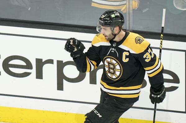 Brad Marchand and Patrice Bergeron got rather intimate at Charlie