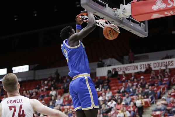 UCLA forward Adem Bona dunks during the first half of the team's NCAA college basketball game against Washington State, Friday, Dec. 30, 2022, in Pullman, Wash. (AP Photo/Young Kwak)