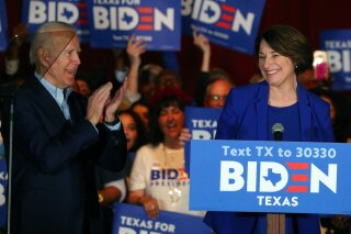 FILE - In this March 2, 2020 file photo, Sen. Amy Klobuchar, D-Minn., endorses Democratic presidential candidate former Vice President Joe Biden at a campaign rally Monday, March 2, 2020 in Dallas. As presumptive Democratic presidential nominee Joe Biden begins the process of choosing a running mate amid the coronavirus crisis, managing the pandemic has become its own version of an audition. For potential picks, lobbying for the job means breaking into the national conversation, positioning themselves as leaders and executing at their day job. (AP Photo/Richard W. Rodriguez)