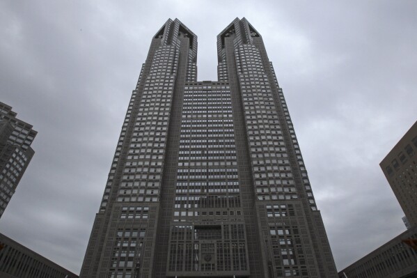 FILE - The Tokyo Metropolitan Government Office building soars in Tokyo, on June 15, 2016. Called “Tokyo Futari Story,” the city hall online site is just that: An effort to create couples, “futari,” in a country where it is increasingly common to be “hitori," or alone. (AP Photo/Shuji Kajiyama, File)