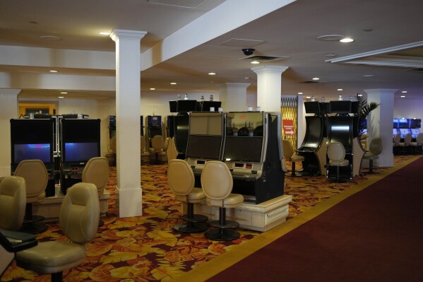 Shut down slot machines adorn the casino floor in preparation for closing the Tropicana hotel-casino Friday, March 29, 2024, in Las Vegas. (AP Photo/John Locher)