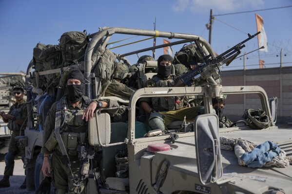 Israeli army troops are seen on the Israeli-Gaza border during a ground operation in the Gaza Strip, Wednesday, Nov. 8, 2023. Prime Minister Benjamin Netanyahu did not elaborate this week when he said that Israel would maintain indefinite 