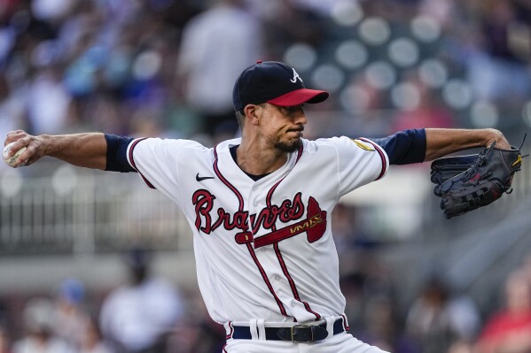 Atlanta Braves starting pitcher Charlie Morton delivers to a New York Yankees batter during the first inning of a baseball game Wednesday, Aug. 16, 2023, in Atlanta. (AP Photo/John Bazemore)
