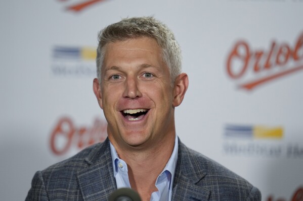 FILE - Baltimore Orioles general manager Mike Elias speaks prior to a baseball game between the Orioles and the Tampa Bay Rays, Sept. 15, 2023, in Baltimore. On the day they held their first official workout, the Orioles announced that pitcher Kyle Bradish would open the season on the injured list with a sprained ulnar collateral ligament. Orioles general manager Mike Elias said Bradish had received a platelet-rich plasma injection to treat the injury. (AP Photo/Julio Cortez, File)