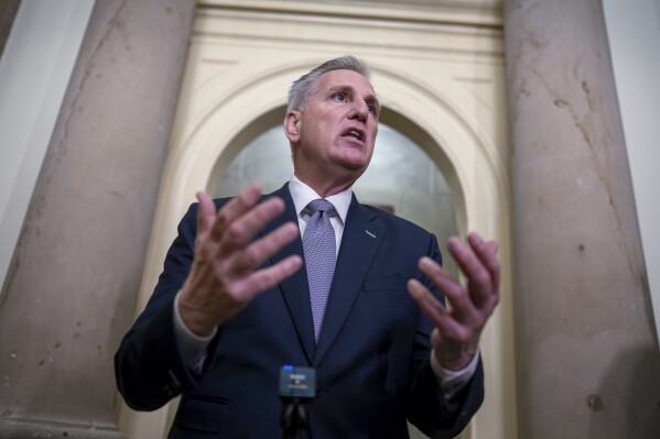 House Speaker Kevin McCarthy, R-Calif., talks to reporters as Congress returns to work in crisis mode with only a few days to go before a government shutdown, at the Capitol in Washington, Tuesday, Sept. 26, 2023. McCarthy faces an insurgency from hard-right Republicans eager to slash spending even if it means closing federal offices to millions of Americans. (AP Photo/J. Scott Applewhite)