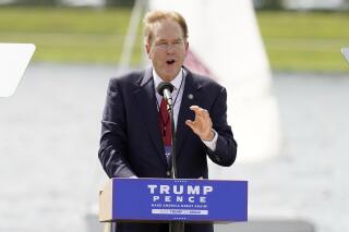 FILE - In this Oct. 27, 2020 file photo, U.S. Rep. Vern Buchanan, R-Fla., speaks during a campaign event in Sarasota, Fla. Buchanan says he's tested positive for the COVID-19 virus even though he was fully vaccinated against the disease. Buchanan, a Republican who represents a Sarasota-based district, said in a news release Monday, July 19, 2021, he got the test recently after experiencing “very mild flu-like symptoms.” (AP Photo/Chris O'Meara, File)