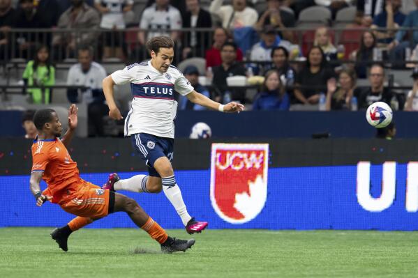 Gauld's late PK goal helps Whitecaps tie Sporting KC 1-1