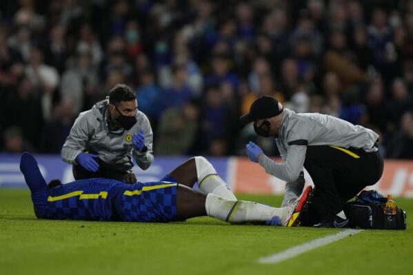 Chelsea's Romelu Lukaku is injured during the Champions League group H soccer match between Chelsea and Malmo at the Stamford Bridge stadium in London, Wednesday, Oct. 20, 2021. (AP Photo/Alastair Grant)