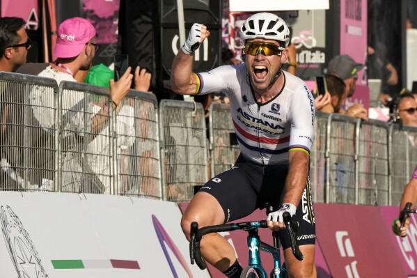 FILE - Britain's Mark Cavendish celebrates as he wins the 21st and last stage of the Giro D'Italia, tour of Italy cycling race, in Rome, Sunday, May 28, 2023. (AP Photo/Alessandra Tarantino, File)