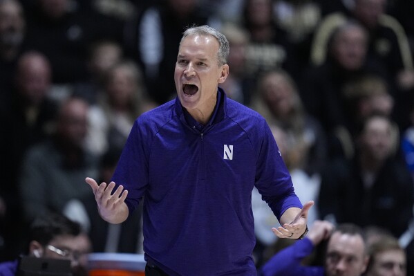 Northwestern Wildcats head coach Chris Collins yells to his team as they played against Purdue during the first half of an NCAA college basketball game in West Lafayette, Ind., Wednesday, Jan. 31, 2024. (AP Photo/Michael Conroy)