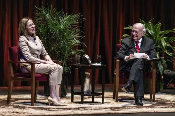 U.S. Supreme Court Justice Amy Coney Barrett speaks with Professor Robert A. Stein at Northrop Auditorium as part of the Stein Lecture Series in Minneapolis, Monday, Oct. 16, 2023. (Richard Tsong-Taatarii/Star Tribune via AP)