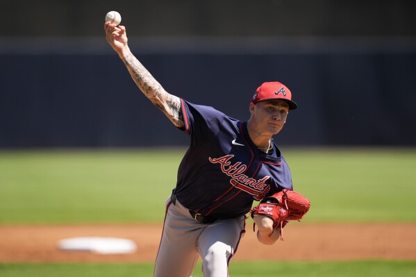 Atlanta Braves starting pitcher AJ Smith-Shawver throws during the first inning of a spring training baseball game against the New York Yankees Sunday, March 10, 2024, in Tampa, Fla. (AP Photo/Charlie Neibergall)