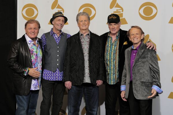 FILE - Bruce Johnston, from left, David Marks, Brian Wilson, Mike Love and Al Jardine of The Beach Boys pose backstage at the 54th annual Grammy Awards in Los Angeles on Feb. 12, 2012. A new documentary about the band premieres May 24 on Disney+. (AP Photo/Mark J. Terrill, File)